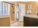 Well lit bathroom featuring walk-in shower, neutral colors and granite vanity at 8316 Granada Blvd, Orlando, FL 32836