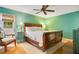 Spacious bedroom with hardwood floors, and a door to the backyard at 8316 Granada Blvd, Orlando, FL 32836