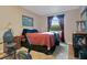 Comfortable bedroom with a large window, and a cozy reading corner at 8316 Granada Blvd, Orlando, FL 32836