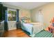 Charming bedroom with hardwood floors, and bright natural light at 8316 Granada Blvd, Orlando, FL 32836