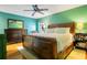 Large primary bedroom with hardwood floors, and views of the backyard at 8316 Granada Blvd, Orlando, FL 32836