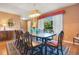 Elegant dining room featuring a large window, chandelier, and a traditional-style dining set at 8316 Granada Blvd, Orlando, FL 32836
