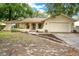 Charming single-story home featuring a well-maintained lawn and an attached two-car garage at 8316 Granada Blvd, Orlando, FL 32836