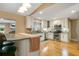Modern kitchen with stainless steel appliances, granite countertops, and a breakfast bar at 8316 Granada Blvd, Orlando, FL 32836