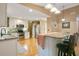 Beautiful kitchen featuring stainless steel appliances, granite countertops, and an island with seating at 8316 Granada Blvd, Orlando, FL 32836