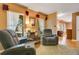 Comfortable living room featuring two recliners and plenty of natural light at 8316 Granada Blvd, Orlando, FL 32836