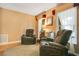 Inviting living room with hardwood floors, an area rug, and two recliners at 8316 Granada Blvd, Orlando, FL 32836