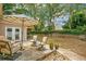 Back patio featuring outdoor seating and beautiful brick accent wall at 8316 Granada Blvd, Orlando, FL 32836