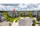 View of modern homes in a cul-de-sac with well-maintained lawns at 901 Ocean Course Ave, Davenport, FL 33896