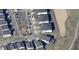 Overhead shot of suburban neighborhood with community playground, basketball court, and single-Gathering houses at 901 Ocean Course Ave, Davenport, FL 33896