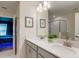 Elegant bathroom features dual sinks, modern fixtures, and a spacious shower for a spa-like experience at 901 Ocean Course Ave, Davenport, FL 33896