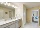 Spacious bathroom with a double vanity, sleek countertops, and modern fixtures, ensuring convenience and style at 901 Ocean Course Ave, Davenport, FL 33896
