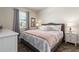 Stylish bedroom features elegant decor, a comfortable bed, and soft natural light from the window at 901 Ocean Course Ave, Davenport, FL 33896