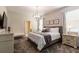 Bright bedroom boasts a stylish chandelier, comfortable bed, and modern media for a relaxing retreat at 901 Ocean Course Ave, Davenport, FL 33896