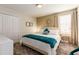 Bedroom with a queen-sized bed, closet, and side tables at 901 Ocean Course Ave, Davenport, FL 33896