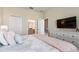 Serene bedroom features stylish decor, a comfortable bed, and an adjacent bathroom for added convenience at 901 Ocean Course Ave, Davenport, FL 33896