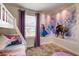 Fun bedroom with bunk beds and Frozen-themed wallpaper at 901 Ocean Course Ave, Davenport, FL 33896