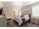 Bedroom featuring a queen bed, dresser and a stylish chandelier at 901 Ocean Course Ave, Davenport, FL 33896