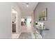 Elegant foyer with high ceilings, glass table, leading into the kitchen and living area at 901 Ocean Course Ave, Davenport, FL 33896