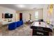 Fun game room with an air hockey table, Minion themed decorations, a TV, and comfortable seating at 901 Ocean Course Ave, Davenport, FL 33896