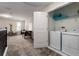 Convenient laundry room with modern appliances, ample storage, and natural light from nearby windows at 901 Ocean Course Ave, Davenport, FL 33896