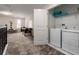Loft area with washer, dryer, and space for entertainment, combining utility with versatile leisure options at 901 Ocean Course Ave, Davenport, FL 33896