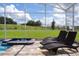 Screened-in pool with integrated spa, plus sun loungers to create the perfect oasis at 901 Ocean Course Ave, Davenport, FL 33896