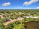 Overhead view capturing the neighborhood's design with a view of the lake, trees, and building rooftops at 960 Mooring Ave # 202, Altamonte Springs, FL 32714