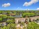 Wide aerial perspective of the condo community, lake, and surrounding greenery at 960 Mooring Ave # 202, Altamonte Springs, FL 32714
