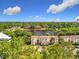 Bird's-eye view capturing the condo complex and the tranquil lake with fountains at 960 Mooring Ave # 202, Altamonte Springs, FL 32714