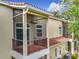 View of stacked condo balconies with metal railings and a view of the red tile roof at 960 Mooring Ave # 202, Altamonte Springs, FL 32714