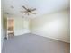 Bedroom featuring a ceiling fan, neutral carpet and paint, and closet at 960 Mooring Ave # 202, Altamonte Springs, FL 32714