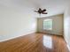 Spacious bedroom boasts gleaming hardwood floors and a large window, providing ample natural light at 960 Mooring Ave # 202, Altamonte Springs, FL 32714