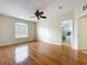 Bright bedroom with hardwood floors, a ceiling fan, and an ensuite bathroom entrance at 960 Mooring Ave # 202, Altamonte Springs, FL 32714