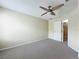 This cozy bedroom has neutral paint, carpet, and ceiling fan at 960 Mooring Ave # 202, Altamonte Springs, FL 32714