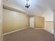 Spacious carpeted bedroom with neutral paint and a chandelier at 960 Mooring Ave # 202, Altamonte Springs, FL 32714