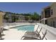 Inviting community pool surrounded by lounge chairs, providing a perfect spot for relaxation and recreation at 960 Mooring Ave # 202, Altamonte Springs, FL 32714