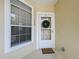 Inviting condo entrance with a welcome mat and a wreath on the front door at 960 Mooring Ave # 202, Altamonte Springs, FL 32714