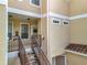 Detailed view of the condo exterior, showing unit entrances and staircase access at 960 Mooring Ave # 202, Altamonte Springs, FL 32714