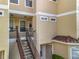 Close-up of condo units with a staircase, offering a charming and accessible entrance at 960 Mooring Ave # 202, Altamonte Springs, FL 32714