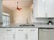 Kitchen with granite countertops, stainless steel sink, updated appliances and view to the living area at 960 Mooring Ave # 202, Altamonte Springs, FL 32714