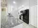 Modern kitchen with granite counters, stainless steel sink, and updated black appliances at 960 Mooring Ave # 202, Altamonte Springs, FL 32714