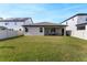 Large, well-maintained backyard with green grass and privacy fence, perfect for outdoor activities at 10072 Hampshire Oaks Dr, Orlando, FL 32825