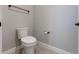 Simple bathroom with a standard white toilet and neutral wall color at 10072 Hampshire Oaks Dr, Orlando, FL 32825