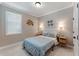 Cozy bedroom with natural light, stylish wall decor, and well-placed sconces at 10072 Hampshire Oaks Dr, Orlando, FL 32825
