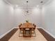 Elegant dining room with a modern chandelier and stylish wooden table at 10072 Hampshire Oaks Dr, Orlando, FL 32825