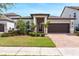 Charming one-story home featuring manicured landscaping and a welcoming front entry at 10072 Hampshire Oaks Dr, Orlando, FL 32825