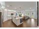 Spacious kitchen featuring white cabinets, stainless steel appliances, and a granite island at 10072 Hampshire Oaks Dr, Orlando, FL 32825