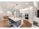 Kitchen island with granite countertops, pendant lighting, and stainless steel appliances at 10072 Hampshire Oaks Dr, Orlando, FL 32825