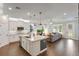 Open kitchen featuring stainless steel appliances, granite countertops, and a central island at 10072 Hampshire Oaks Dr, Orlando, FL 32825